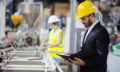 Young quality inspector checking production line