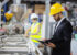 Young quality inspector checking production line